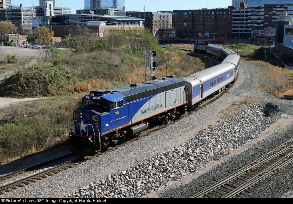 RNCX 105 leads train P075-08 past the signal at Raleigh Tower